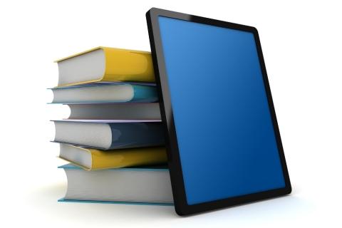 Photo of books and computer tablet.